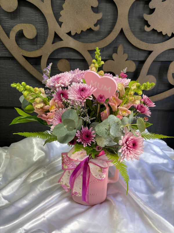 mixed seasonal bouquet in a pink vase
